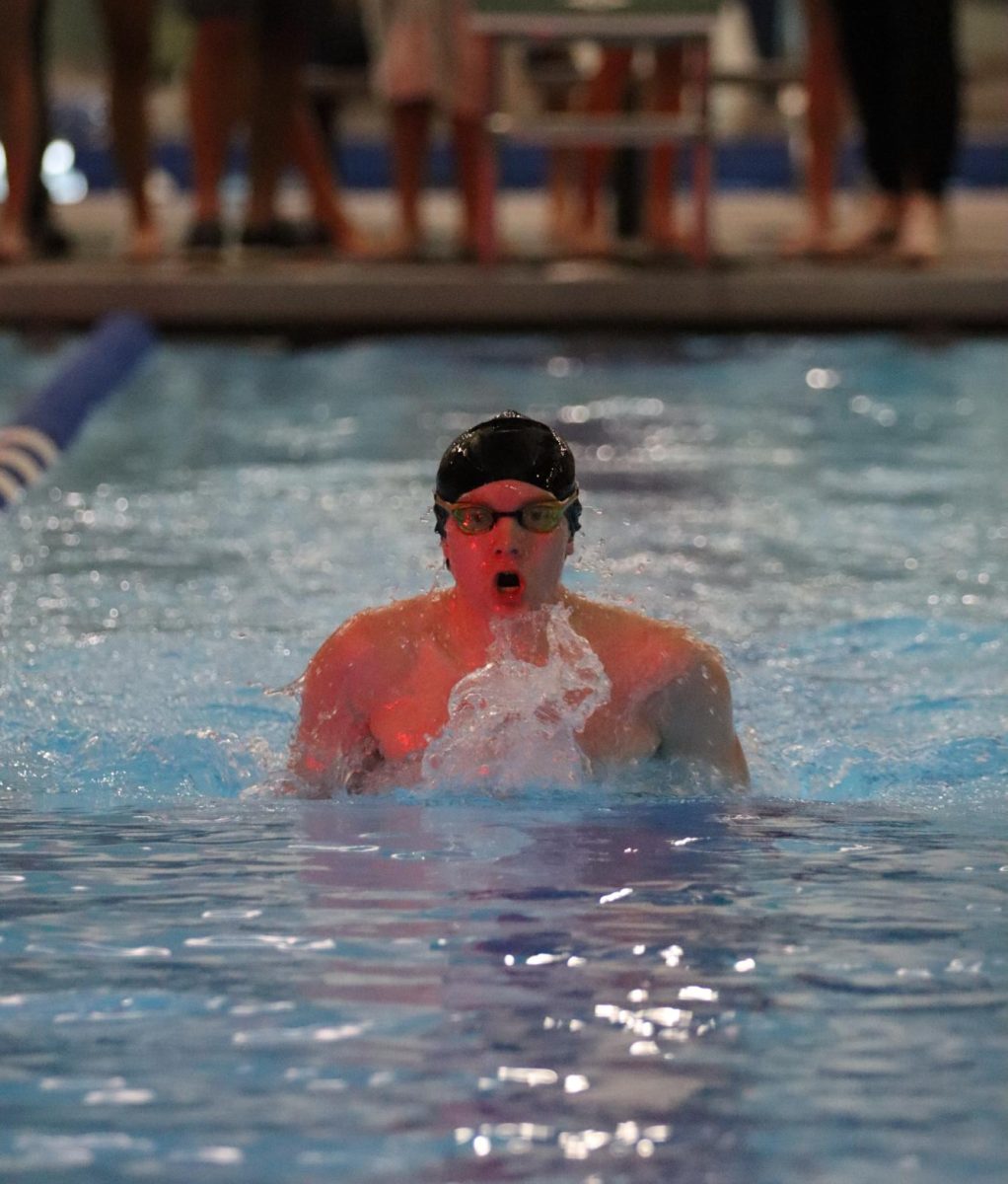 Brayden Wolters, senior, swims the breaststroke last year against Shaker Heights. Wolters qualified for districts last year.