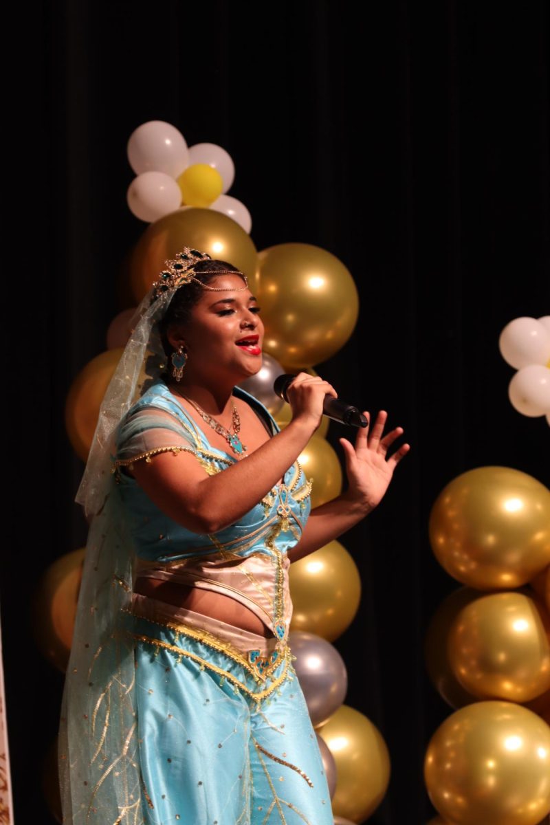 Paula King, senior, and members of the Mustang Express perform for local children as part of their annual Royal Tea. Show choir members embody Disney characters and perform an original play using well-known Disney songs.