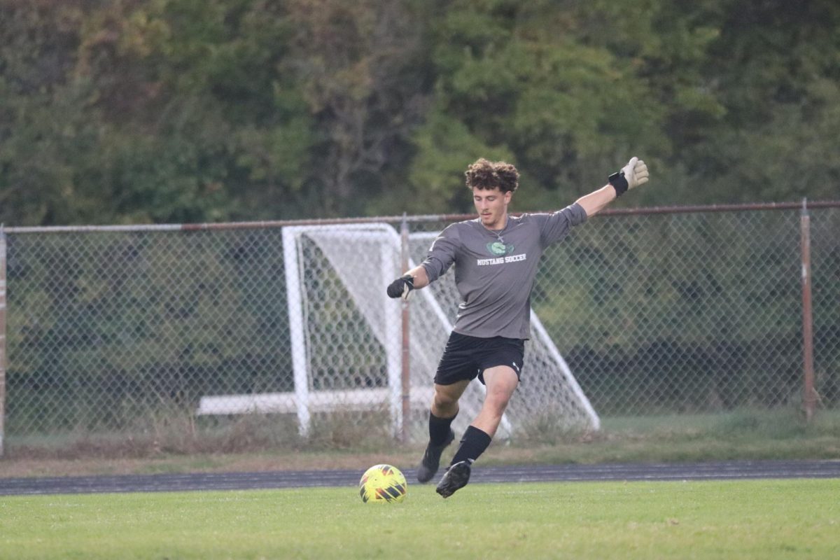 Goalie Josh Crnic, senior, kicks the ball downfield during post season play. Though the boys team ended with a loss to Perrysburg, the team spent the season ranked in the top ten in Ohio.
