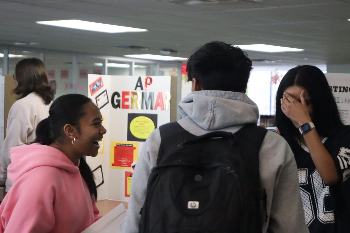 Lena Lay, junior, promotes AP Chemistry at the AP fair.