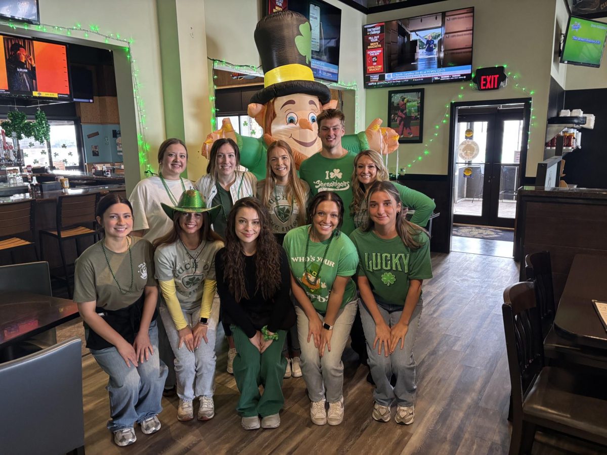 Sarina Fares, senior, works at On Tap Grille and Bar in Medina as a hostess. She and the crew celebrated St. Patrick's Day together.